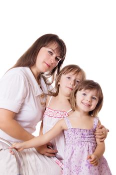 Happy mother with two little daughters isolated on white
