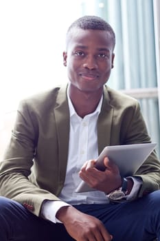 smiling successful businessman with tablet pc outdoor in summer 