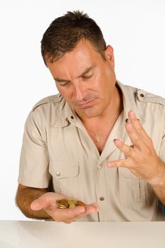 Guy counting a handful of coins, a personal finance concept