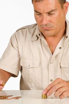 Guy counting some small change, a personal finance concept