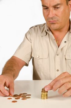 Guy piling up some coins, a personal finance concept