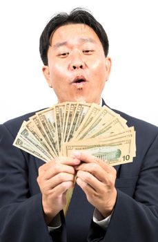 Businessman holding money isolated over white background