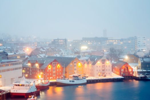 Aerial view of Tromso Cityscape at dusk with winter mist Norway