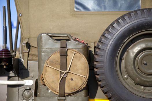 Detailed back side of army jeep with tire and jerrycan