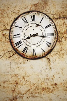 an old vintage clock on a dirty wall