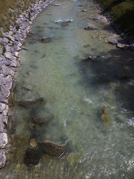 closeup of a river in alps with stones