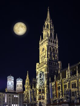 Night scene from Munich Town Hall and Frauenkirche with moon in Germany Bavaria