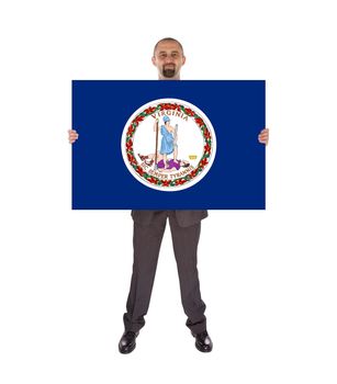 Smiling businessman holding a big card, flag of Virginia, isolated on white
