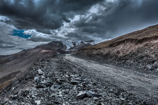 Road in Himalayas near Tanglang la Pass  - Himalayan mountain pass on the Leh-Manali highway in stormy weather. Ladakh, India