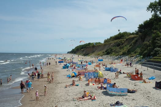 Beach and paragliders in Trzesacz city in Poland