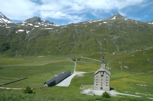 Valley and some buildings nearby Simplon pass in Switzerland