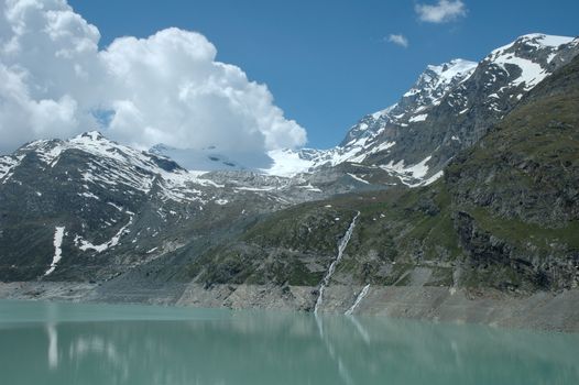 Lake nearby Mattmark dam in Alps in Switzerland