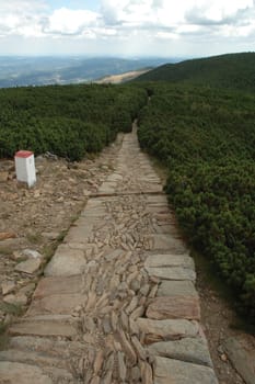 Trail with border post in Karkonosze mountains in Poland / Czech republic