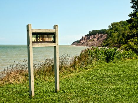 no swimming sign on the shores of lake ontario, huron,new york