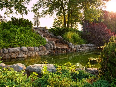 small waterfall in a formal garden