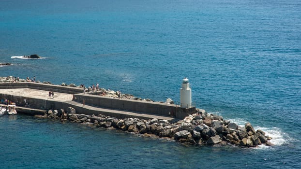 lighthouse over the sea in Camogli, Italy