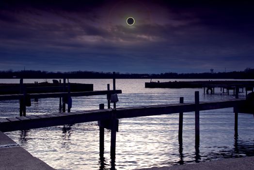 dock and solar eclipse scene