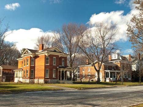 pretty village in winter with old victorian homes