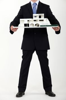 Architect presenting model housing