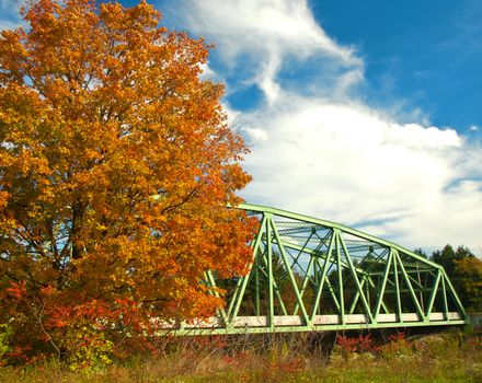 iron bridge in autumn scene