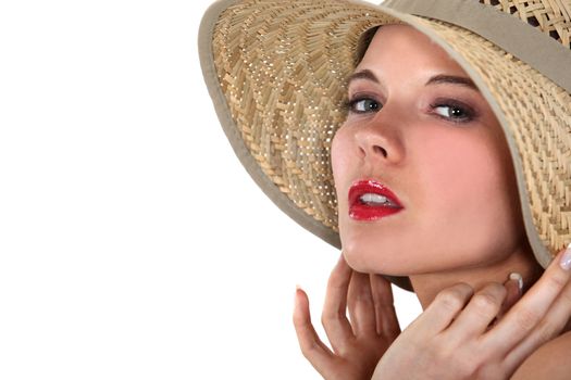 Blond woman posing in straw hat