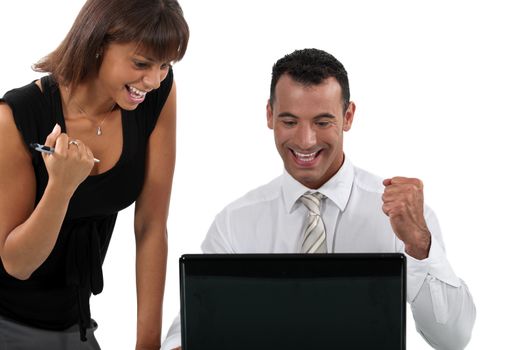 Young business couple at a laptop