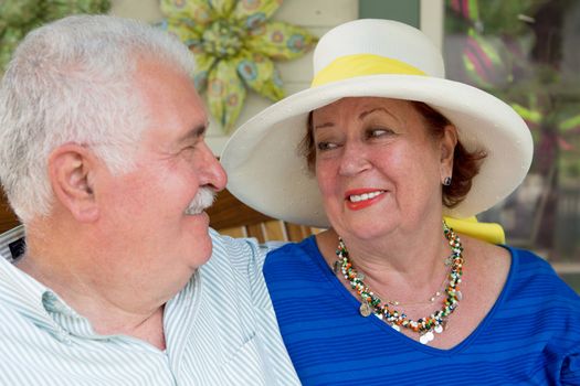 Some marriages last longer when you don't take the life too serious. Older couple looking at each other.