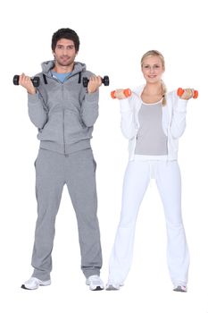 Couple lifting weights