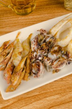 A traditional fish appetizer and a beer to wash it down