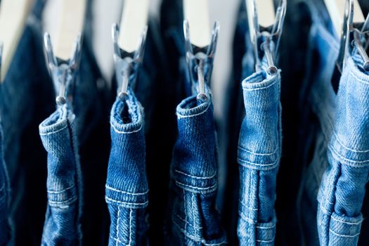 Row of hanged blue jeans