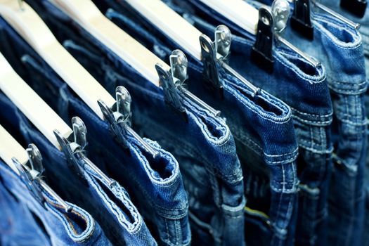 Row of hanged blue jeans