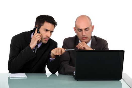 Executives in front of computer