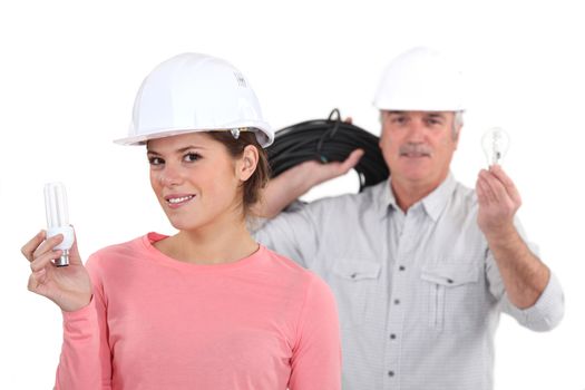 Tradespeople holding lightbulbs