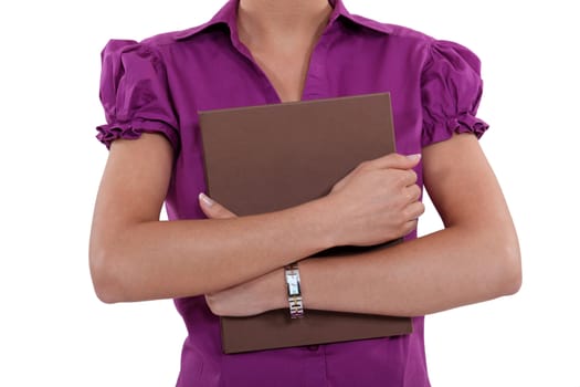 Woman holding a file to her chest
