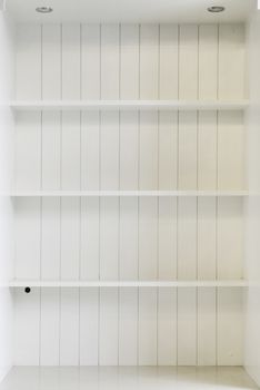 Empty white wooden shelf 