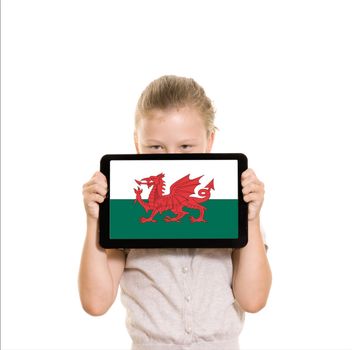 Girl holding tablet pc displaying flag of Wales