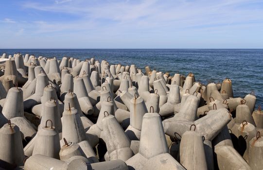 Tetrapods is concrete that is used as a breaking wave 