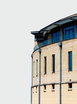 Side view of modern office building isolated on white background with copy space.