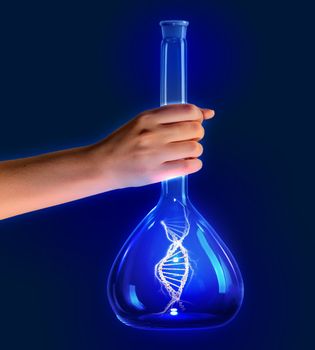 Close up of human hand holding tube with DNA molecule