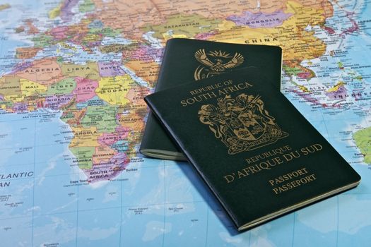 South African Passport With the World map in the Background