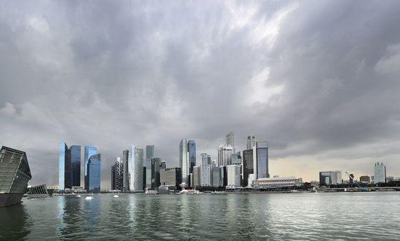Skyline of Singapore with a dark stormy sky 