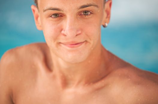 Portrait of a teen close-up in a swimming pool .