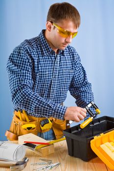 worker takes carpenter vise