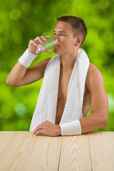 young boy drinks water