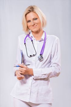 beautiful female doctor on blue background