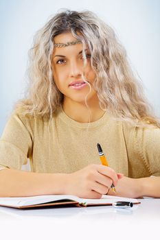 beautyful young female with ballpoint pen