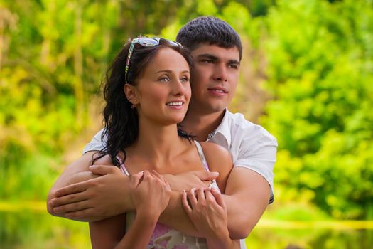 couple hugging in park