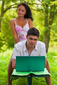 couple loking in laptop