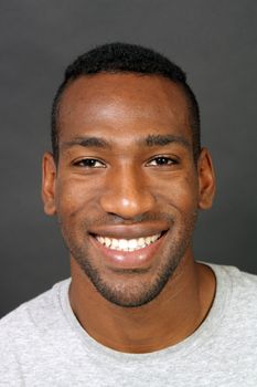 A handsome, smiling black man, headshot.