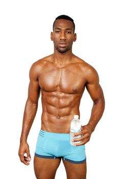 A handsome, muscular black make athlete, holding a bottle of water, isolated on a white background with generous copyspace.